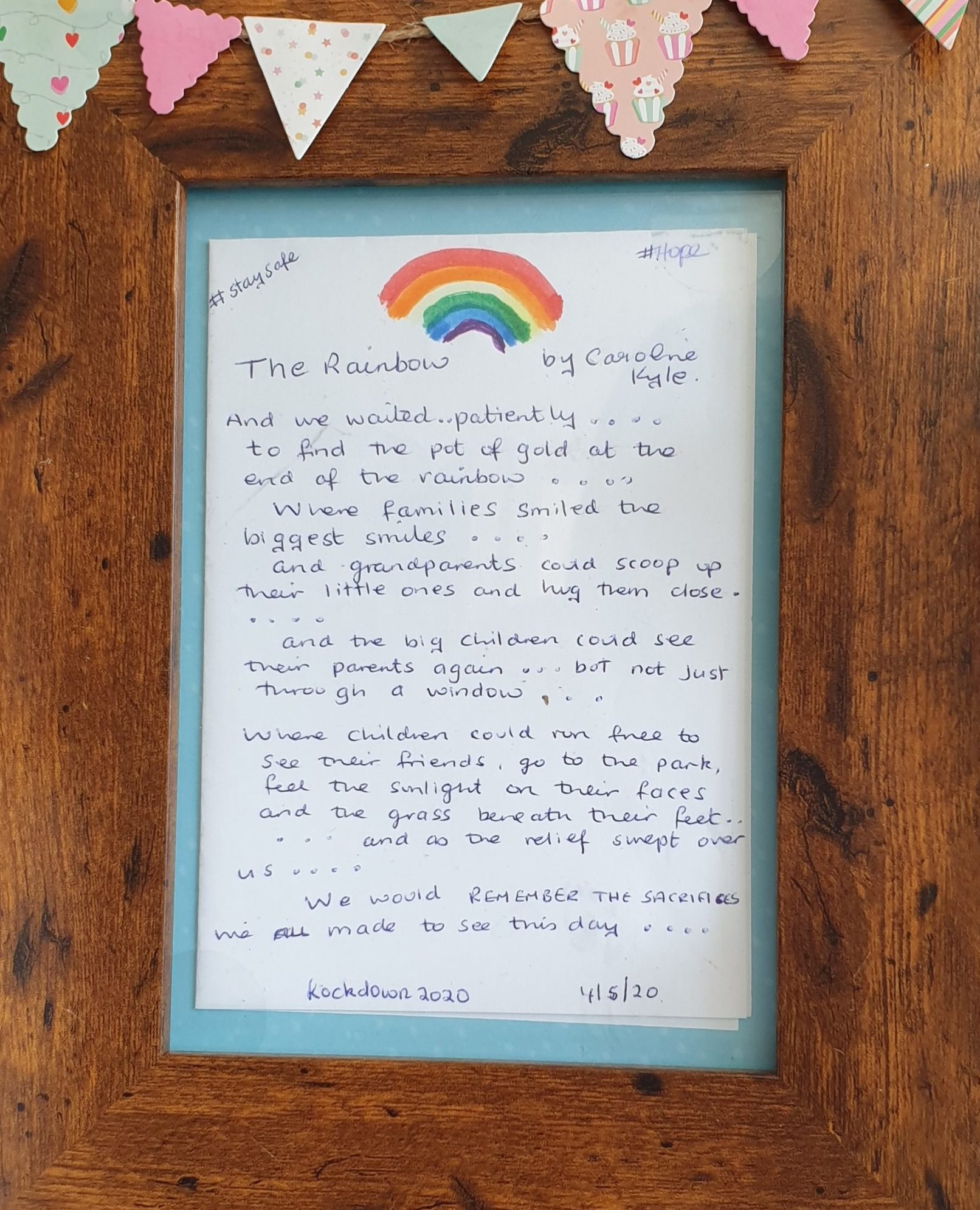Framed poem titled The Rainbow. The poem is about Covid-19